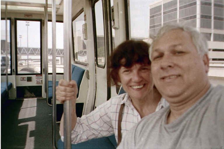 Charles and Susan enjoying sightseeing about the airport in one of the train shuttles. We only had this shuttle to ourselves a short time -- the rest of the trip between the various terminals it was almost full!